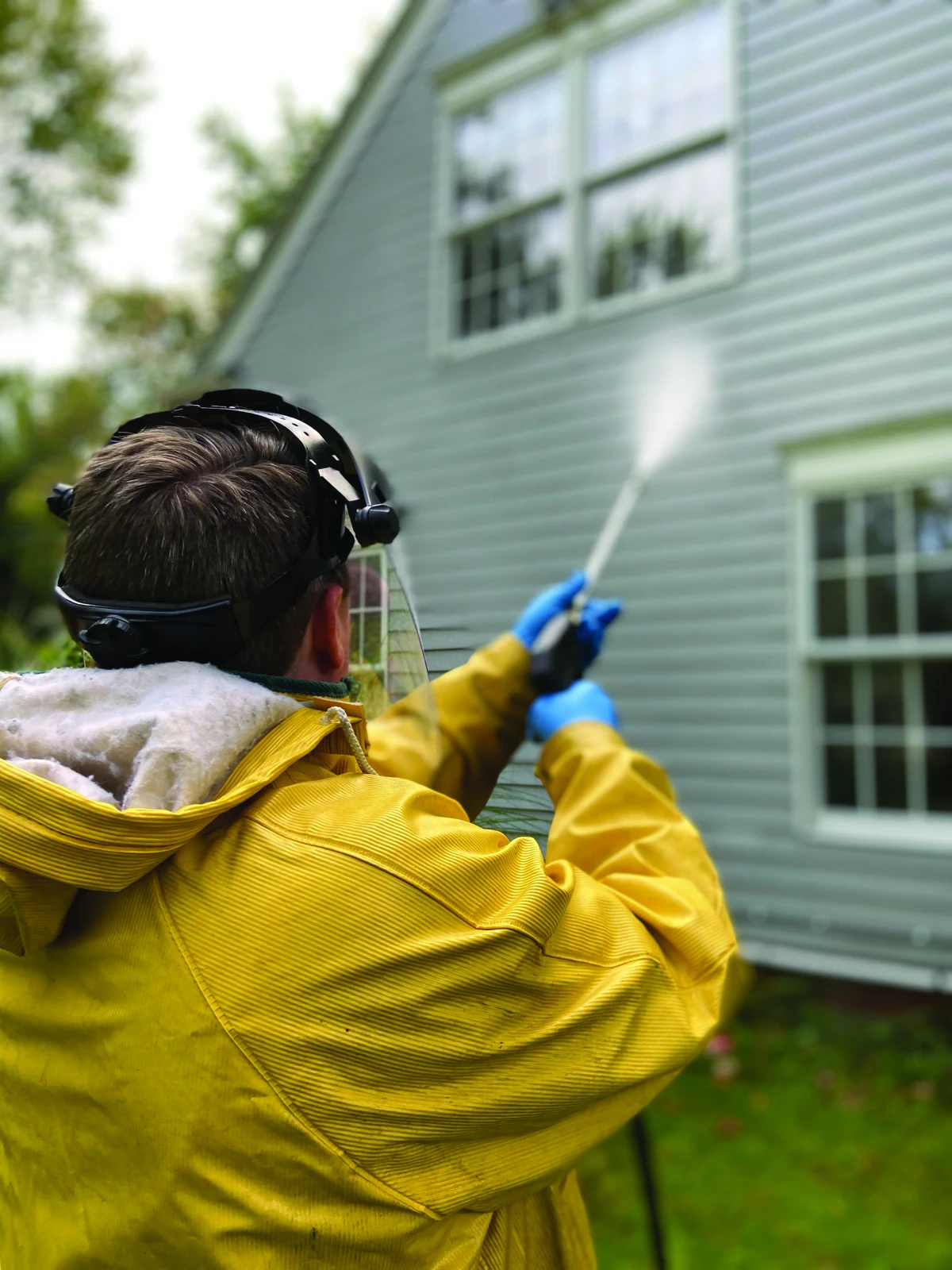 Exterior siding being cleaned, from the company brochure